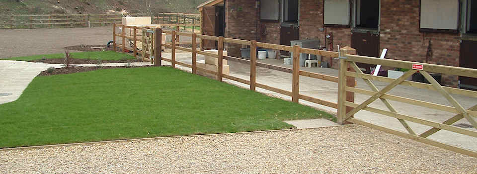 New Turf, paving, wash down area, wooden rail fencing and paddock for Stables in Newmarket